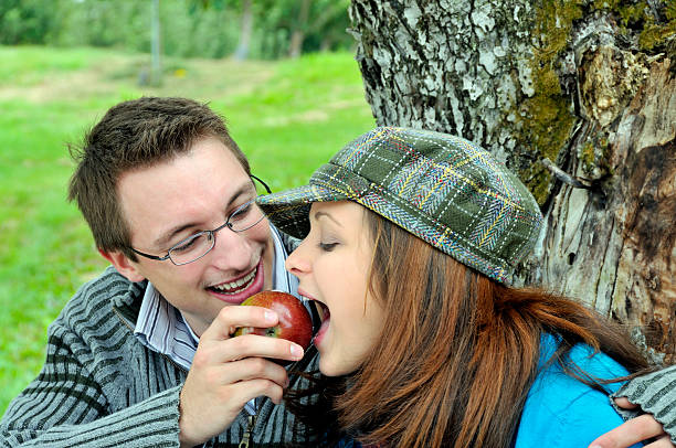 istock Boyfriend Feeds Apple to Girlfriend 124024010