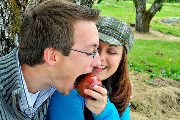 istock Girlfriend Feeds Apple to Boyfriend 124024073