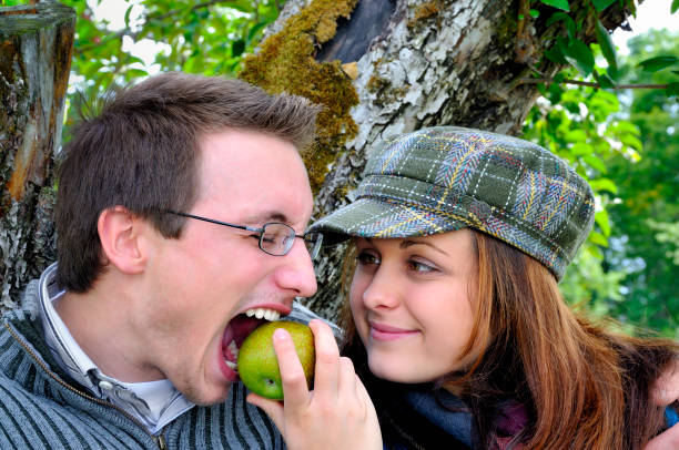 istock Girl Feeding Her Boyfriend an Apple 124024302