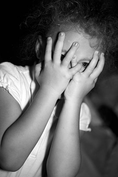 istock five year old girl playing in the dark 124024819
