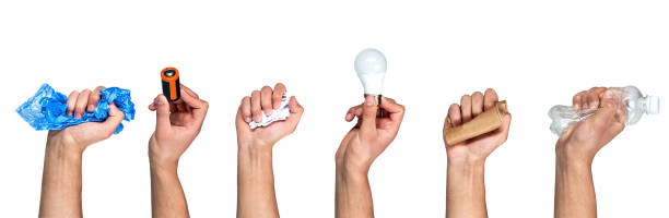 istock Save the planet. Different types of waste in the hands on a gray background. Sort garbage and environment concept. 1240249725