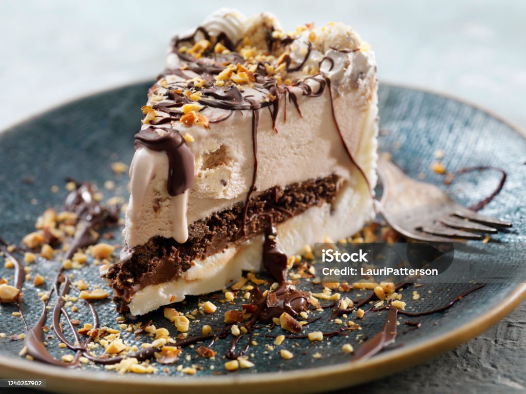 Cookie Dough Ice Cream Cake with Chocolate Sauce and Crushed Almonds Ice Cream Pie Stock Photo