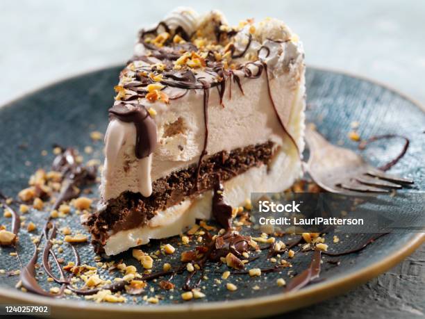 Cookie Dough Ice Cream Cake With Chocolate Sauce And Crushed Almonds Stock Photo - Download Image Now