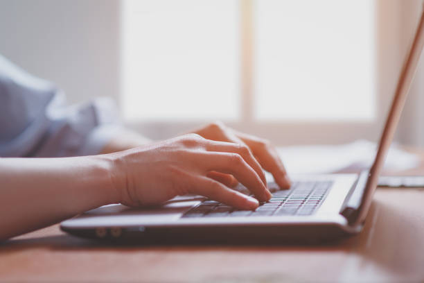 istock Woman working at home office hand on keyboard close up 1240262268
