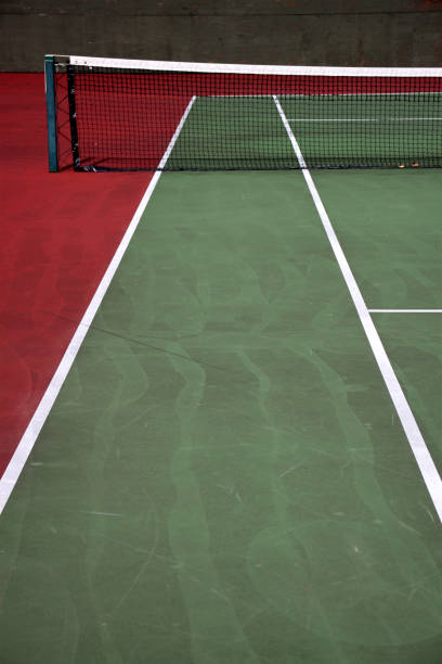 istock Various angles of green tennis courts with white stripes and nets 1240262270