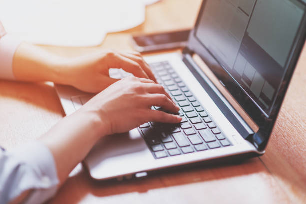 istock Woman working at home office hand on keyboard close up 1240262272