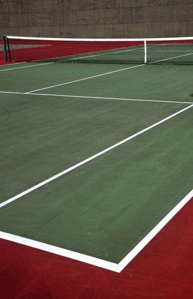 istock Various angles of green tennis courts with white stripes and nets 1240262820