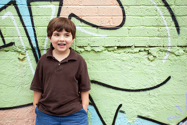 istock Cute boy by colorful wall 124027587