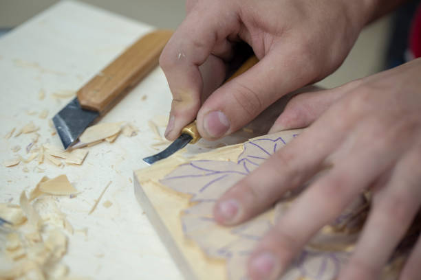 istock carpenter working with wood, retro tinted, close up 1240288321