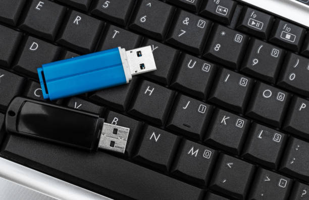 istock Flash drives on the laptop keyboard. Top view. 1240288952