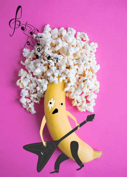 creative photo of a banana that plays rock. funny rocker musician - shrank imagens e fotografias de stock