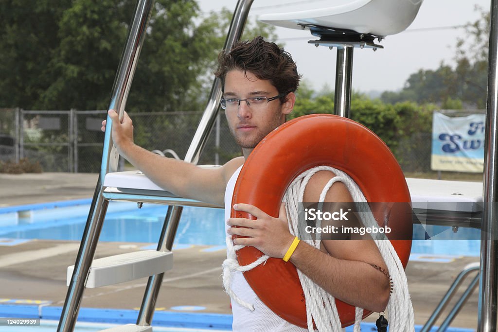 Lifeguard on duty. Posed lifeguard with equipment ready for action. Lifeguard Stock Photo