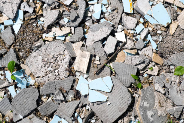 istock Construction waste, broken concrete panels, tiles on ground in sunny day, top view 1240313686