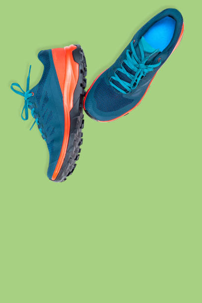 istock blue sneakers on a green background 1240315336