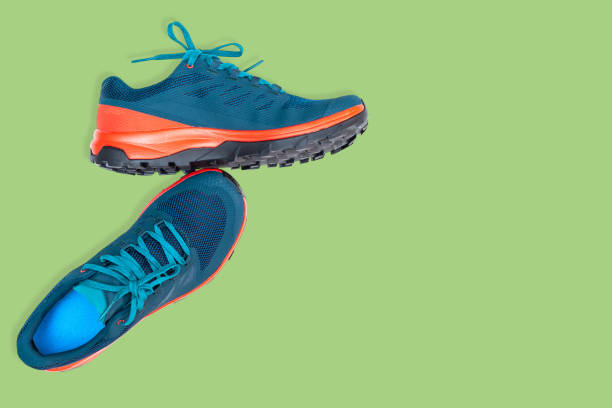 istock blue sneakers on a green background 1240316379