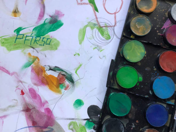 istock kid watercolor painting 1240341838