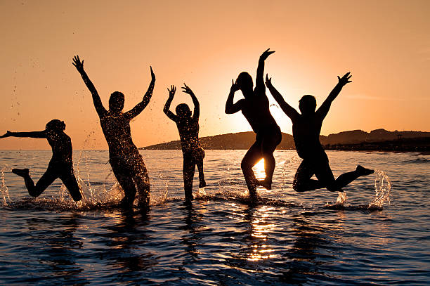 istock Silhouette of family jumping 124034239