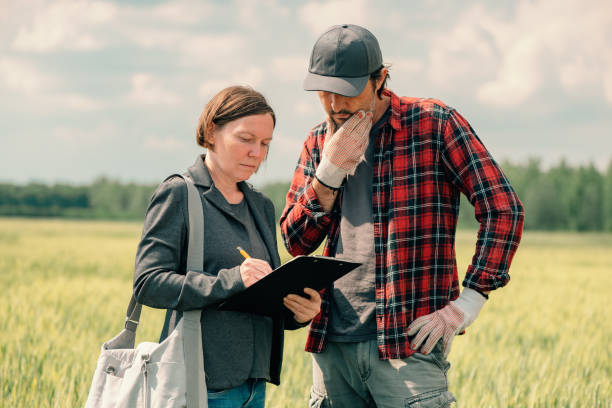 istock Mortgage loan officer assisting farmer in financial allowance application process 1240345018