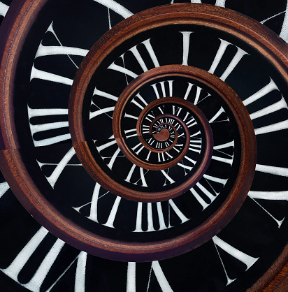 Time running in a spiral. Infinity of time. Infinite fractal of the clock face. Abstraction