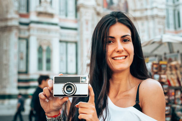istock tourist in florence with a camera - italy 1240381879