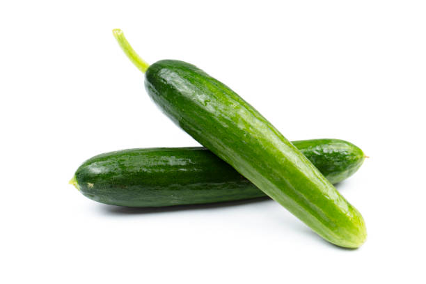 istock healthy fresh vegetables, cucumber on white background. 1240383452