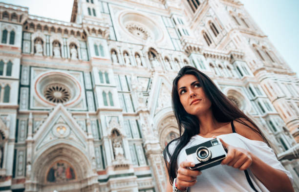 istock tourist in florence with a camera - italy 1240383453