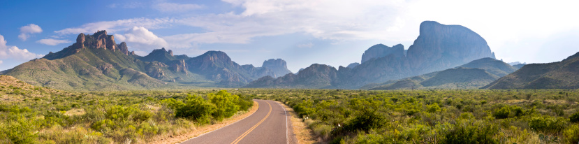 This is the panoramic view driving from Panther Junction across the desert floor toward the Chisos Mountains and the Chisos Basin at Big Bend National Park in west Texas.