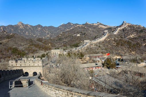 A view of The Great Wall of China by autumn time through the wall window, creates a Frame to the image, China.