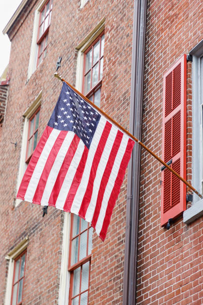 istock American flag on the brick wall background 1240451318