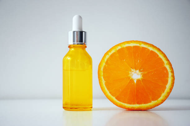 istock Vitamin C serum and half of orange 1240462900