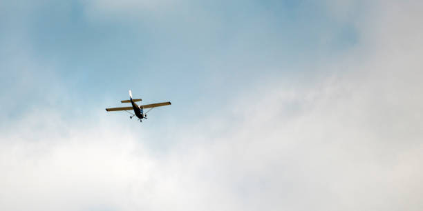 istock Small passenger plane flying in the blue sky 1240481356