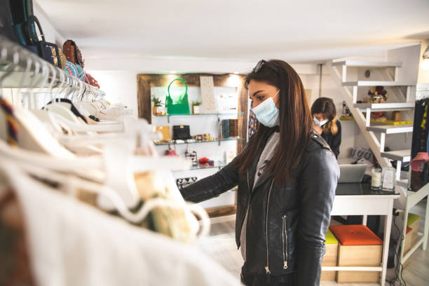 istock Woman shopping protecting herself wearing protective mask 1240491489