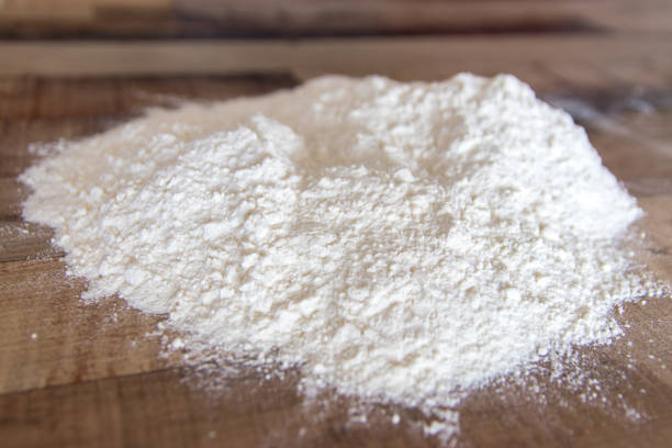 istock Flour on wooden kitchen counter 1240505144