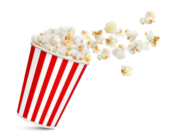 istock Popcorn flying out of red carton cup on white 1240539303