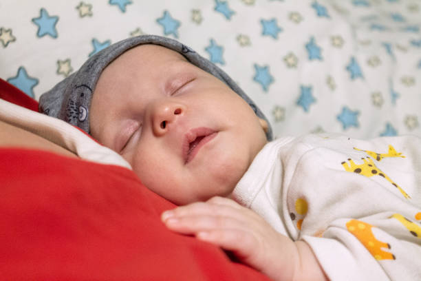 istock sleeping happy newborn babe close up, selective 1240556739