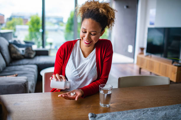 istock Mixed Race Woman in her late 20s taking nutritional supplements 1240570791
