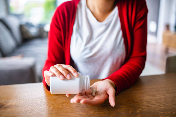 istock Mixed Race Woman in her late 20s taking nutritional supplements 1240571305