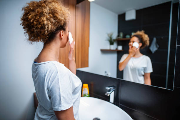 istock Beautiful Mixed Race African Woman Doing her routine in bathroom 1240577521