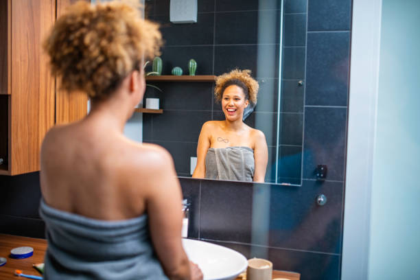 istock Beautiful Mixed Race African Woman Doing her routine in bathroom 1240578044