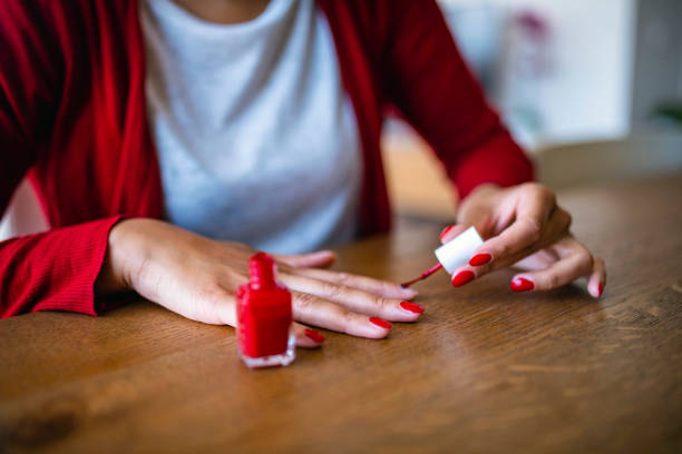 istock Enthusiastic Female Painting Her nails red 1240579081