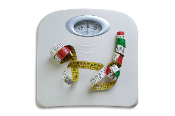istock Scale with measuring tape. Isolated on white background. 1240581142