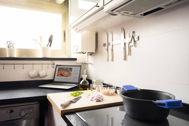 worktop of a bright kitchen with cooking utensils