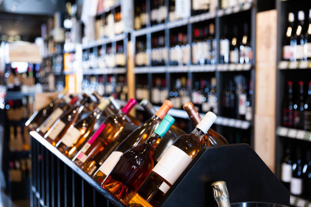 istock Rack with wine bottles in store 1240667942