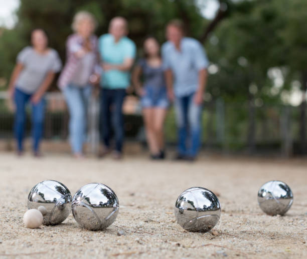 istock Image of people playing petanque on sand 1240671660
