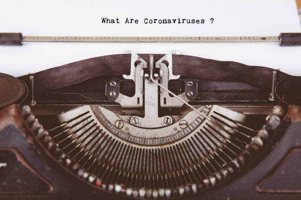 istock Old retro vintage typewriter with typed Coronavirus theme 1240680564