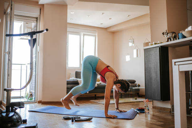 istock Woman exercising at home 1240696569