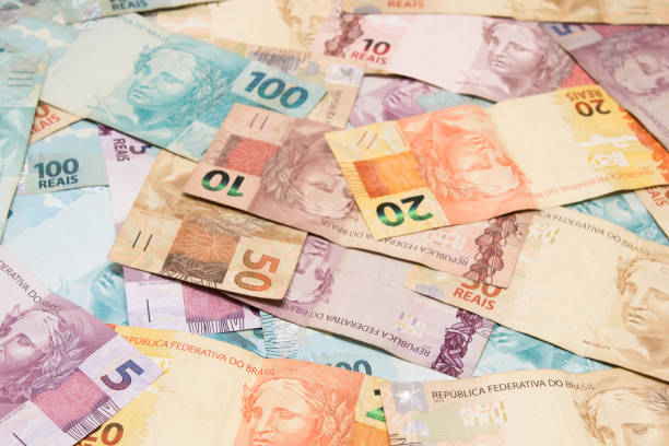 istock Brazilian money background. Bills called Reais (Real). 1240697594