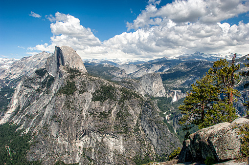 Springtime view of Half Dome and Yosemite Valley from Glacier Point, with Nevada and Vernal Falls in view.\n\nTaken in Yosemite National Park, California, USA