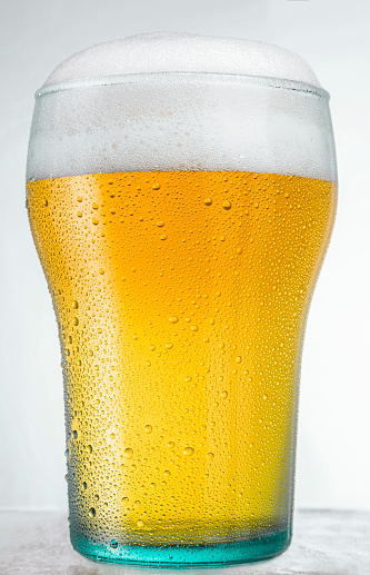 Beer glass close up. Studio isolated.
