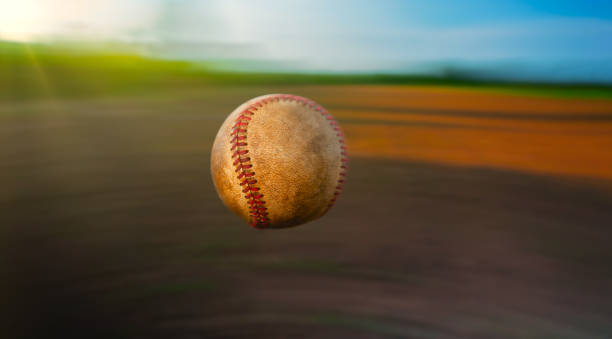 istock old baseball flying on sky motion blur background 1240766023